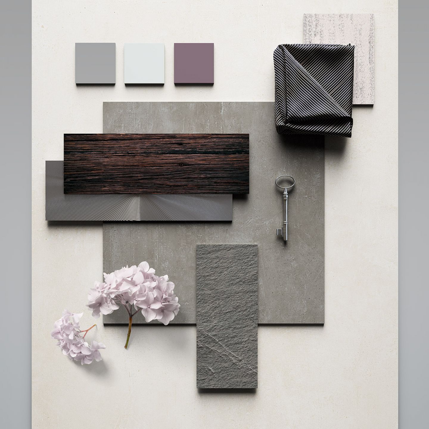 Fliesenauswahl in verschiedenen Grau-, Schwarz- und Weißtönen.