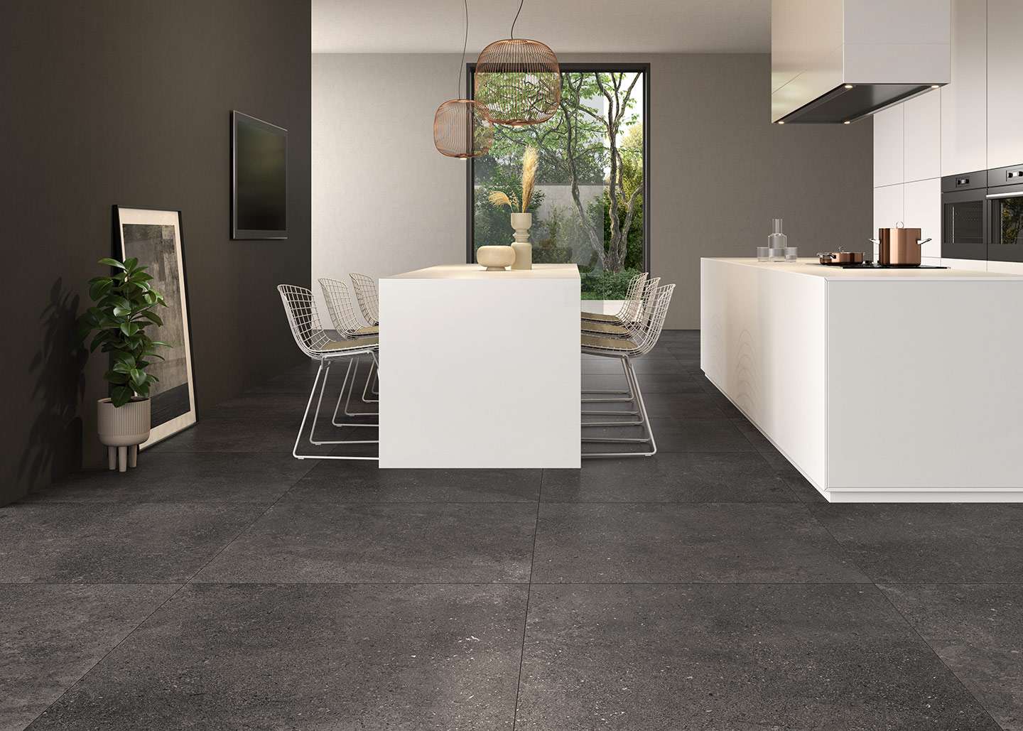 Dunkelgraue Großformat-Bodenfliesen in moderner offener Wohnküche und Essbereich.