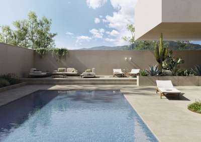 Moderne Poolterrasse mit Porcelaingres Outdoor-Fliesen und eleganter Einrichtung.