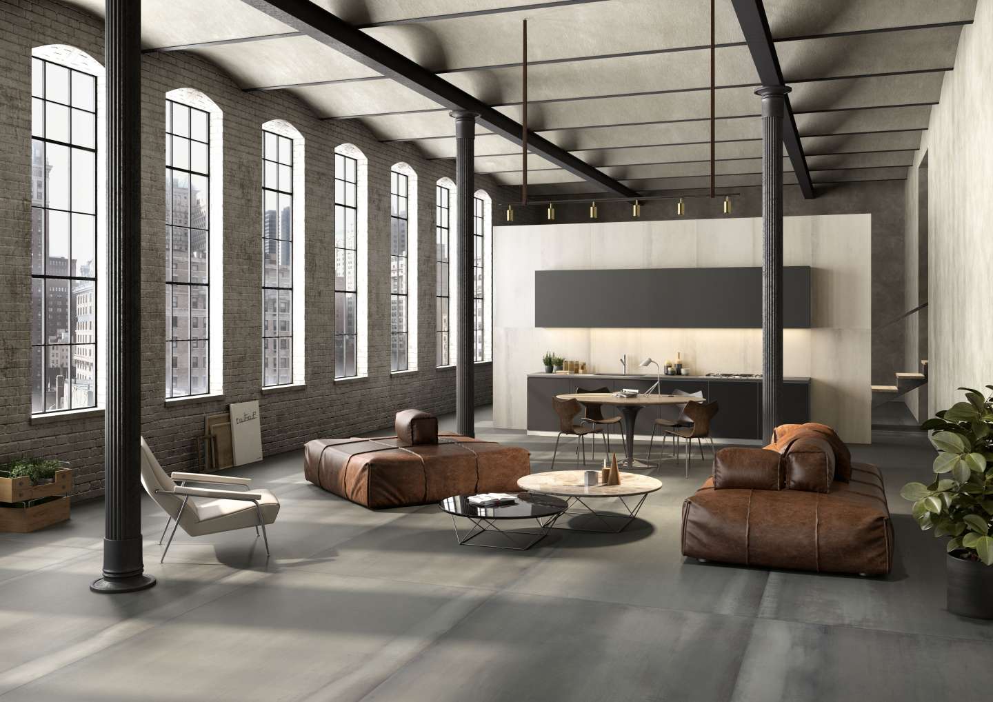 Geräumiges Loft mit modernen grauen Fliesen im Industrial-Stil und offener Wohnküche.
