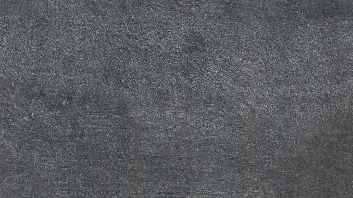 Anthrazitfarbene Feinsteinzeugfliese mit matter Betonoptik.