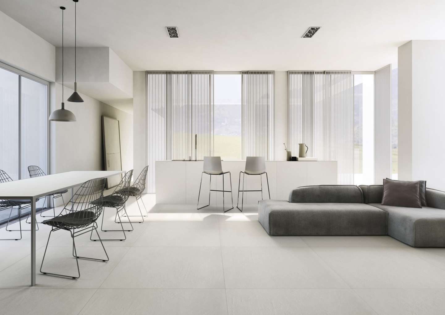 Zeitgemäßer Wohnraum mit hellgrauen Bodenfliesen der Marken Porcelaingres oder Schöner Wohnen.