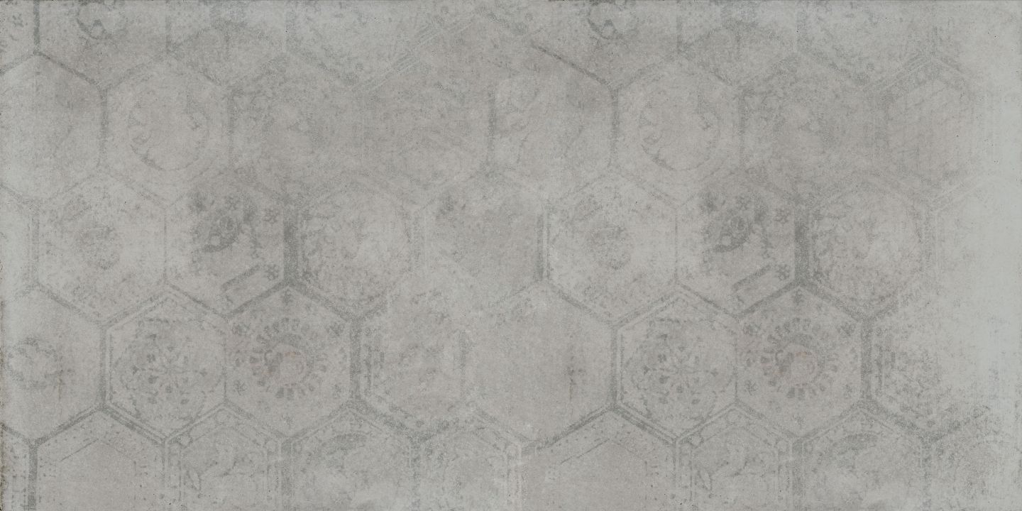 Graue Hexagonfliesen in Betonoptik mit zartem, verblasstem Ornament.