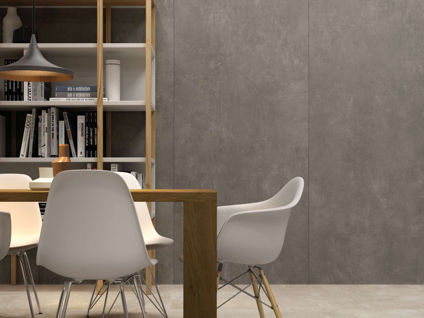 Großformatige graue Betonoptik-Fliesen an der Wand eines modernen Wohnraums.