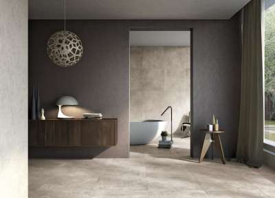 Modernes Bad mit großformatigen Fliesen in Betonoptik von Porcelaingres.