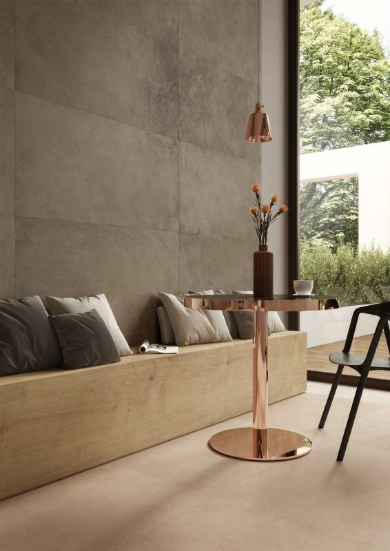 Hochwertige graue Wandfliesen und beige Bodenfliesen in einem modernen Wohnbereich.